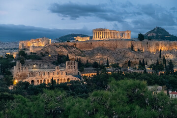 Fototapeta premium Aerial view of Acropolis of Athens with Parthenon temple in the night in Athens, Greece. Ancient Greek architecture at twilight. Popular travel destination