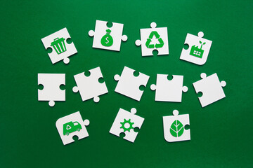 Sustainability Puzzle Pieces with Blank Templates on Green. puzzle pieces arranged in three rows on green background. environmental icons and blank pieces for customization. Green solutions concept