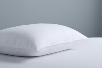 sleek white pillow atop tranquil bed evoking deep restful slumbers and promoting overall health