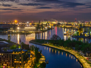 The shipyard landscape of Gdansk by the Motlawa river at dusk. Poland