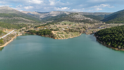 Drone view of forest area and dam
