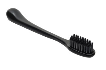 Sleek black toothbrush with charcoal bristles
