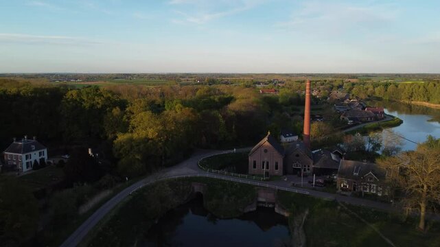 Appeltern, the Netherlands - April 19th 2025: Drone ascending away from 'de Tuut' a historic steam pumping station, previously used for water management. 
