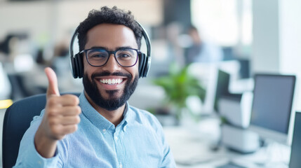 Fototapeta premium Happy call center agent showing thumbs up in modern office environment