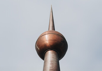 Abstract Perspective of a Metal Spire – Minimalist Architectural Detail Against Sky