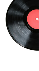 A black vinyl record with a red label spins on a turntable
