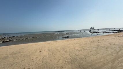 water, beach, sand, shoreline, ocean, sea, coast, nature, tranquil, peaceful, calm, serenity, clear water, wet sand, ripples, waves, gentle waves, shore, summer, travel, vacation, tropical, sunny, war