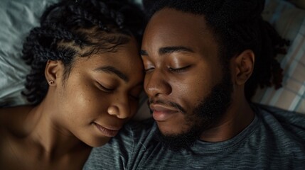 Obraz premium Young couple is sleeping soundly in bed, their faces touching and their eyes closed