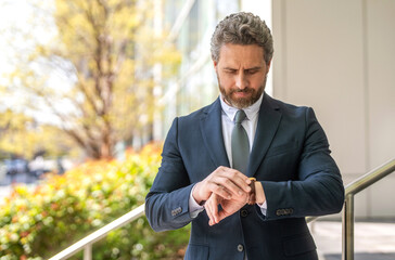 Time management. Punctual man check time on watch being late. Waiting for meeting. Punctual...