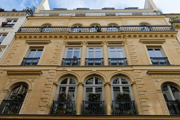 The typical facade of Parisian building, France.