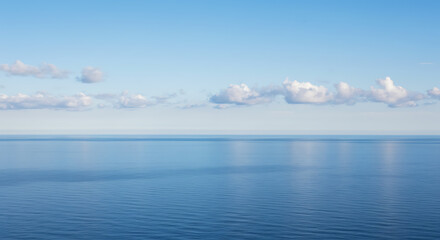 Fototapeta premium Tranquil Seascape: Calm Blue Ocean Horizon Under Peaceful Sky with Minimal Clouds