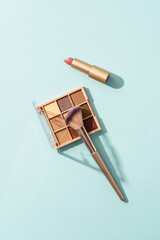 Make up products on blue background.