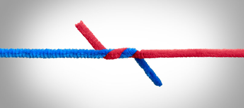 Unity teamwork symbol and strong united partnership relationship concept as two pipe cleaner objects tied together representing business success and diversity suppport joining connected to succeed.