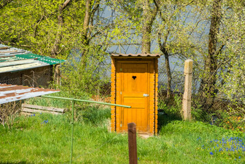 Fototapeta premium A traditional wooden dry toilet in the garden. Czech Republic