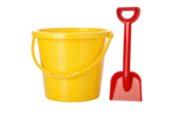 Bright yellow bucket with red shovel ideal for summer beach play and children's outdoor activities