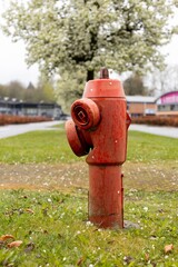 Red fire hydrant. bright red fire hydrant stands on grassy field