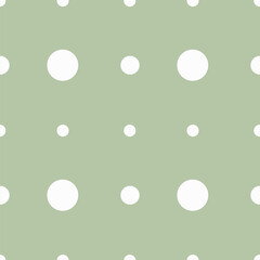 White polka dot print of different sizes on a light background Seamless vector pattern for any surfaces and the web.