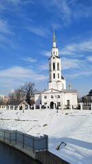 Cathedral of Epiphany in Oryol Fortress Park on sunny winter day. Beautiful white Orthodox church on arrow between rivers Oka and Orlik. Russia, Orel, February 28, 2025