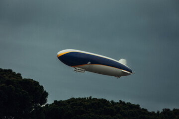 Airship with Tourists Flying in the Sky