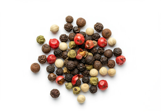 Pile of mixed peppercorns features black white green and red peppercorns creating a colorful and aromatic spice blend used in cooking and seasoning dishes