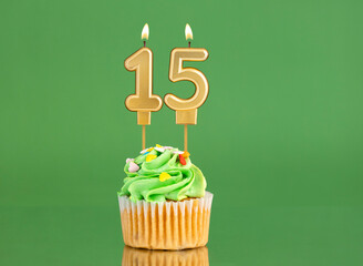 Birthday card with candle and cupcake - Number 15 on a green background