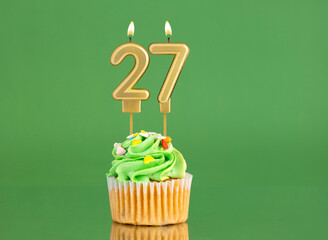 Birthday card with candle and cupcake - Number 27 on a green background