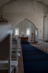 Interior of Old Lutheran Church with Altar.  View of a historic Lutheran church interior with white...