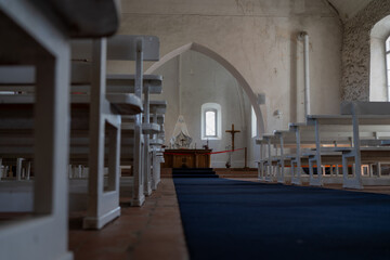 Interior of Old Lutheran Church with Altar.  View of a historic Lutheran church interior with white...