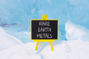 Rare earth metals symbol. Concept words Rare earth metals on beautiful blackboard. Beautiful blue...