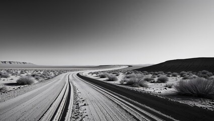 Serpentine dirt road winding through the arid desert landscape scenery