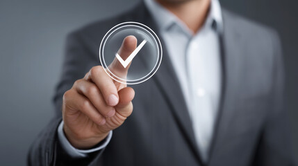 Businessman touching virtual check mark icon, symbolizing quality control, approval, and successful business decisions