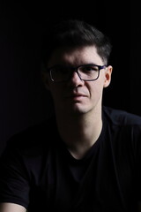 Obraz premium Portrait of a Man in Low Light Environment for Emotional Concept