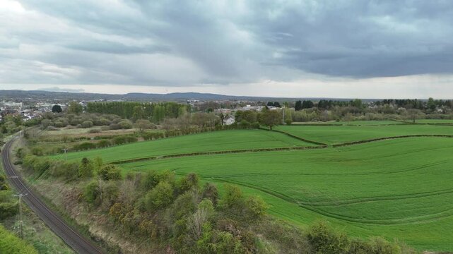 Drone flight over railway and green fields Ballymena UK 2025