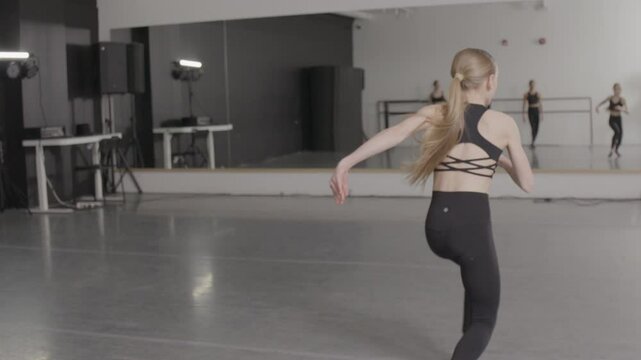 Young girls in dance class performing incredibly majestic dancing