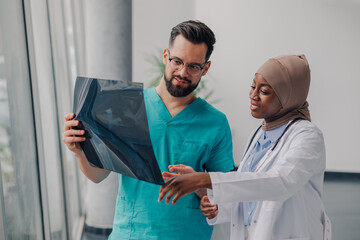 Medical professionals examining x ray in hospital setting