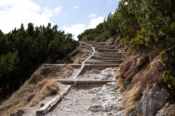Stairs with a stone in the mountains