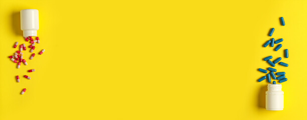 Jars and different scattered pills on yellow background with space for text