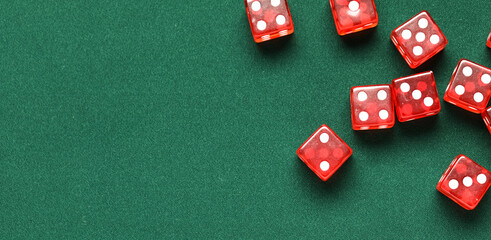 Red game dices on green background