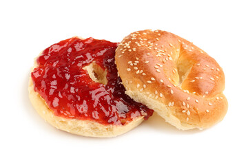 Tasty bagel with strawberry jam on white background