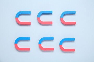 Horseshoe shaped magnets on white background