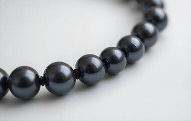 Obraz premium Black Pearl necklace on white background, close up on black pearl necklace 