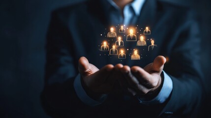 Businessman Holding Holographic Network of Human Icons