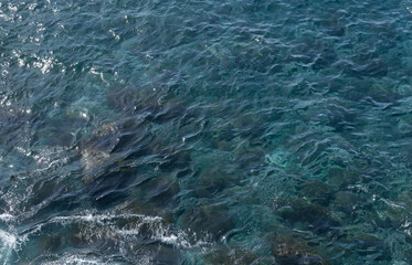 Blue clear sea water on Lido natural pools,  City of Funchal, Madeira island, Portugal