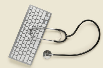 Modern keyboard and stethoscope on light background