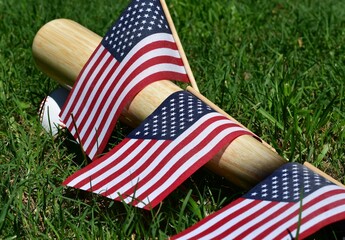 American flag, baseball ball and bat