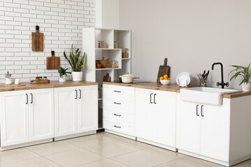 White counter in interior of modern kitchen