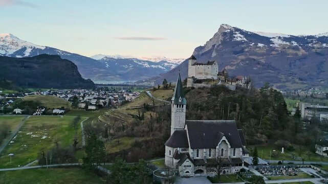 Burg Gutenberg castle in Balzers Liechtenstein with St Nicholas church below