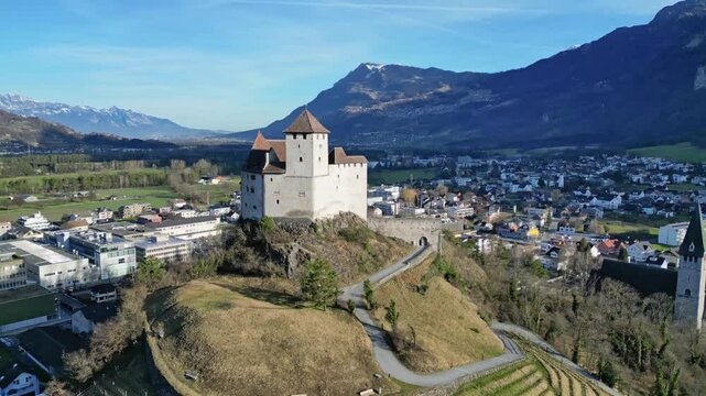 Burg Gutenberg castle in Balzers Liechtenstein with St Nicholas church below
