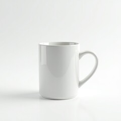 Obraz premium A simple white ceramic mug on a clean surface, perfect for coffee or tea.