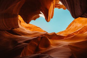 Antelope Canyon's Vibrant Sandstone Passageways with Eroded Wave-like Walls Illuminated by Sunlight